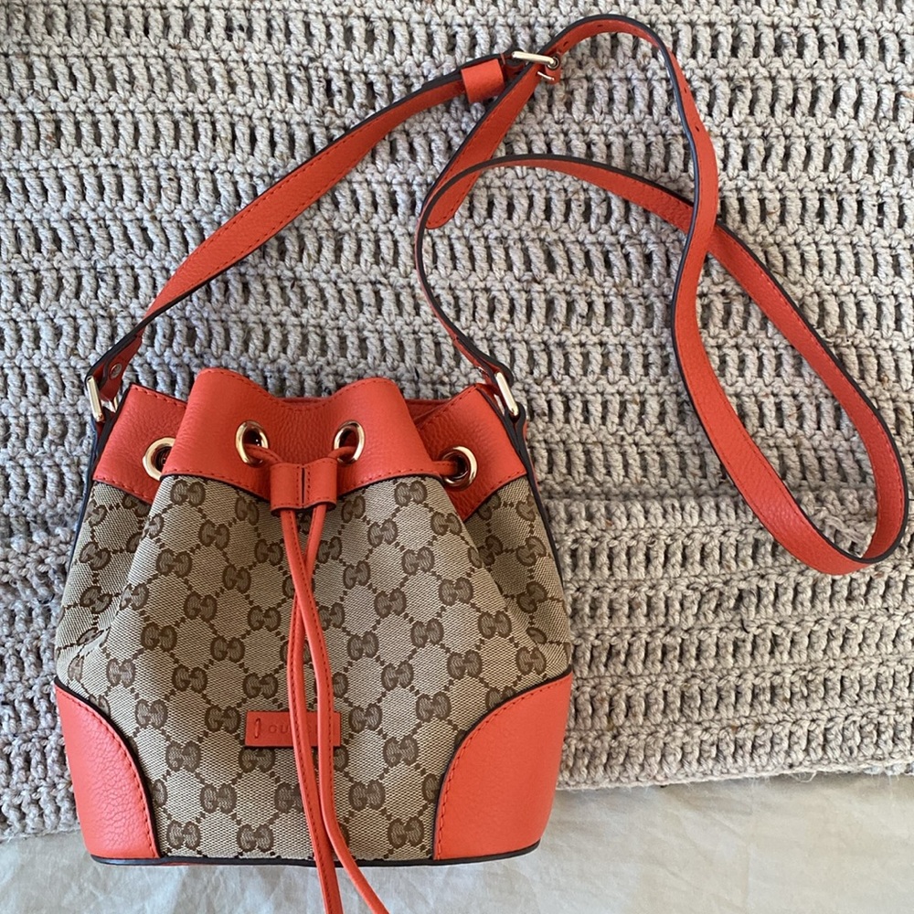 Gucci orange monogram canvas bucket crossbody shoulder bag